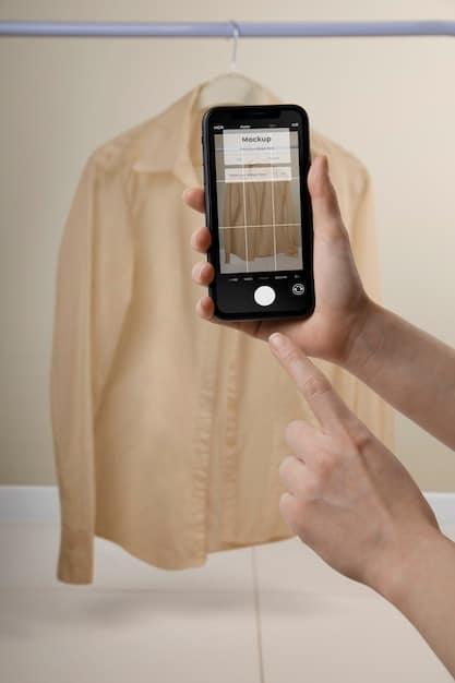 A hand pointing to a clothing description on a smartphone screen. The description includes details about the fabric and fit of the garment.