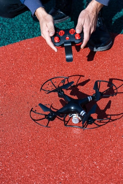 An image featuring a close-up shot of a modern drone's camera gimbal system in operation. The camera is angled downwards, capturing a sprawling cityscape below. The focus should be on the gimbal's stabilization mechanism, highlighting its ability to produce smooth, shake-free images.