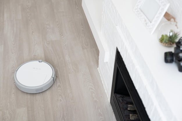 A close-up shot of a robot vacuum transitioning from a hardwood floor to a carpeted area, showcasing its ability to adapt to different floor types. Focus on the brush design and the seamless transition.