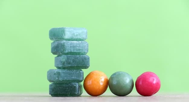 A close-up shot of a variety of colorful and fragrant cleansing bars displayed on a wooden shelf, highlighting their natural ingredients and appealing aesthetic. The shot emphasizes affordability and eco-friendliness.