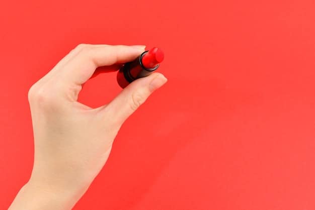 A close-up shot of a woman's hand swatching different shades of lipstick from sample tubes on the back of her hand. The background is blurred to keep the focus on the colors and textures of the lipsticks.