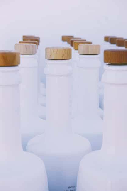 A multi-angle photograph showcasing the progression from regular product package to refillable option - show the original container, the refill package, and the product being used.