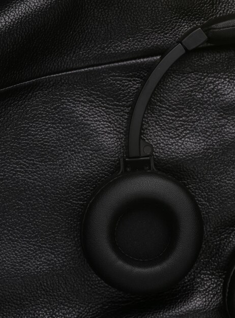 A close-up of a noise-canceling headphone earcup with intricate details, showcasing premium materials and sophisticated design.