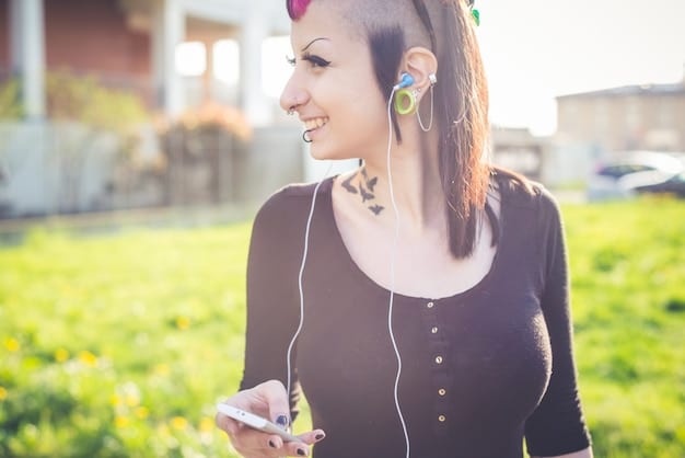 A person smiling while wearing sleek wireless earbuds during a brisk walk in a park, with sunlight catching the outlines of the earbuds, highlighting comfort and everyday usability.