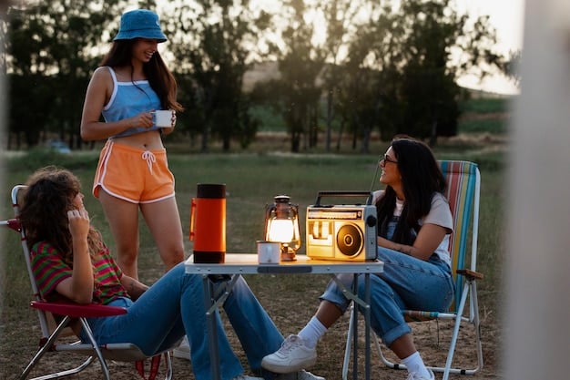 A group of friends enjoying music from a portable Bluetooth speaker around a campfire in the woods, with the speaker illuminating slightly.