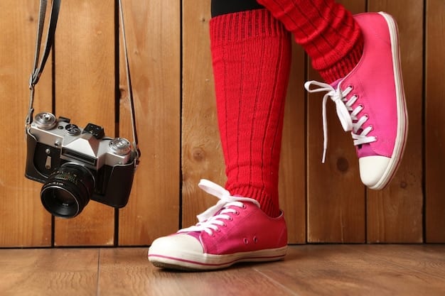 A detailed shot of a person's feet wearing chunky, retro-inspired Shein sneakers paired with ribbed athletic socks and relaxed-fit distressed jeans, capturing the essence of modern streetwear footwear.