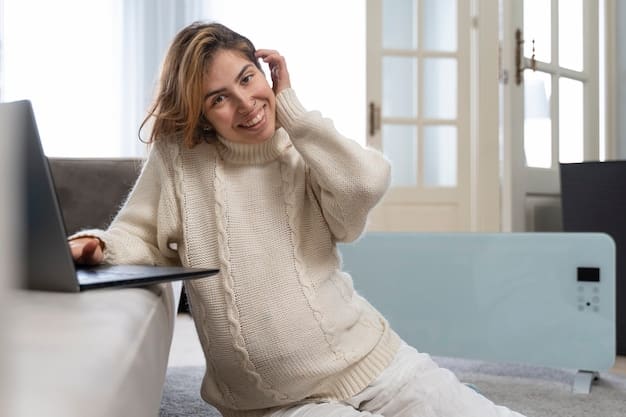 A woman wearing a stylish Shein coordinated knit loungewear set in a neutral color, working comfortably at a laptop on a sofa in a bright, modern living room, with a delicate necklace visible.