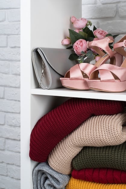 A neatly organized closet featuring a capsule wardrobe, with an emphasis on basic items like stacked neutral-colored t-shirts, folded jeans, and hanging simple dresses. The shelves are tidy, and the overall impression is one of efficiency and style.