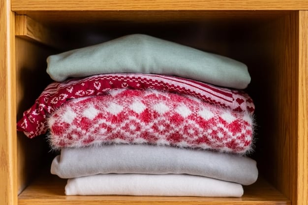 A neatly folded stack of various colored knit sweaters in a clean, organized wardrobe drawer, emphasizing proper storage and care for longevity.