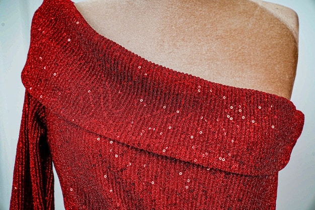 A close-up of a Shein party dress featuring intricate sequin and lace details, draped artfully on a mannequin, highlighting the texture and embellishments.