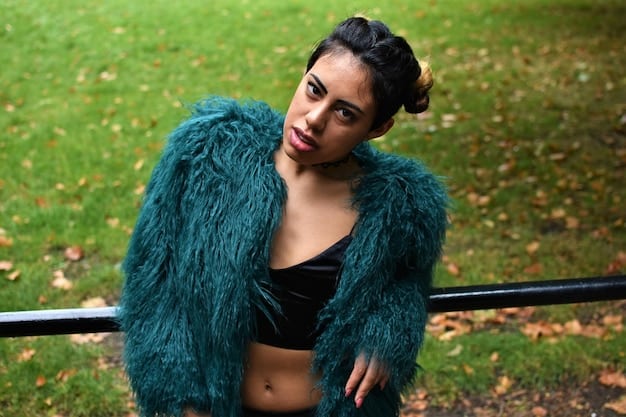 A close-up shot of a stylish Shein puffer jacket in a deep emerald green, showcasing the detailed quilting and a soft, matte fabric texture. The zipper and snap buttons are visible, highlighting quality closures.