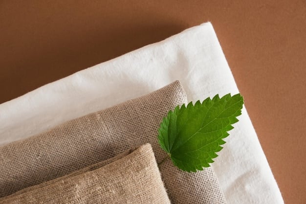 Close-up of various fabric swatches, including organic cotton, recycled polyester, and linen, with descriptive labels highlighting their eco-friendly properties.