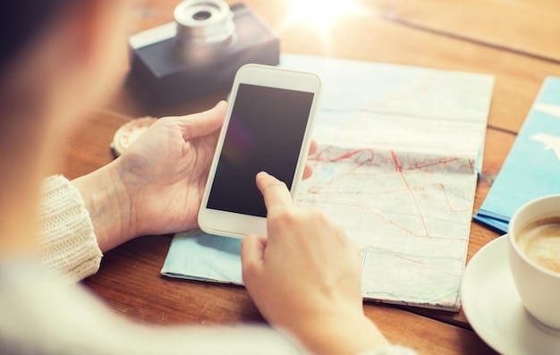 A person using a mobile app on their phone to track expenses. The background shows a coffee shop scene, illustrating how technology can aid in budgeting. This highlights a key tip from The Ultimate Guide to Shopping on a Budget: Tips and Tricks for Saving Money.