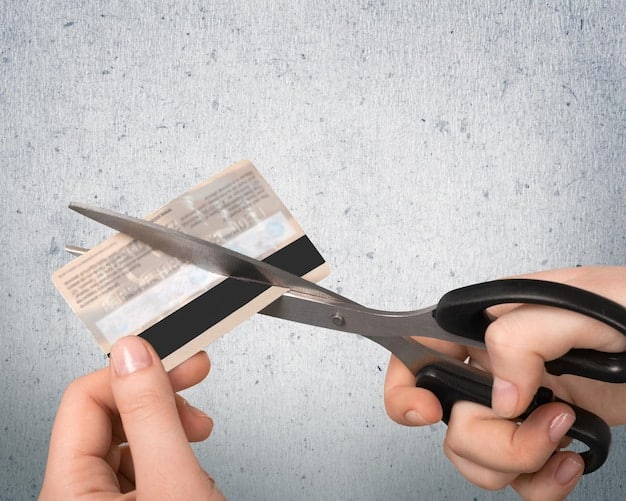 A close-up of a hand clipping coupons from a newspaper, with scissors in the foreground. The image conveys the idea of actively seeking out savings. This embodies The Ultimate Guide to Shopping on a Budget: Tips and Tricks for Saving Money.