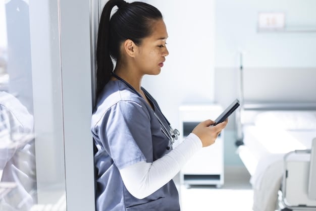 A doctor using a tablet to access patient information in a hospital hallway, with a blurred background of other healthcare professionals. The image demonstrates how technology can streamline workflows and improve efficiency, contributing to burnout prevention.