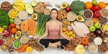 Colorful healthy foods surrounding a calm woman meditating, symbolizing nutrition's impact on mood.