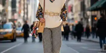 Stylish woman showcasing budget fashion strategies in a vibrant city setting